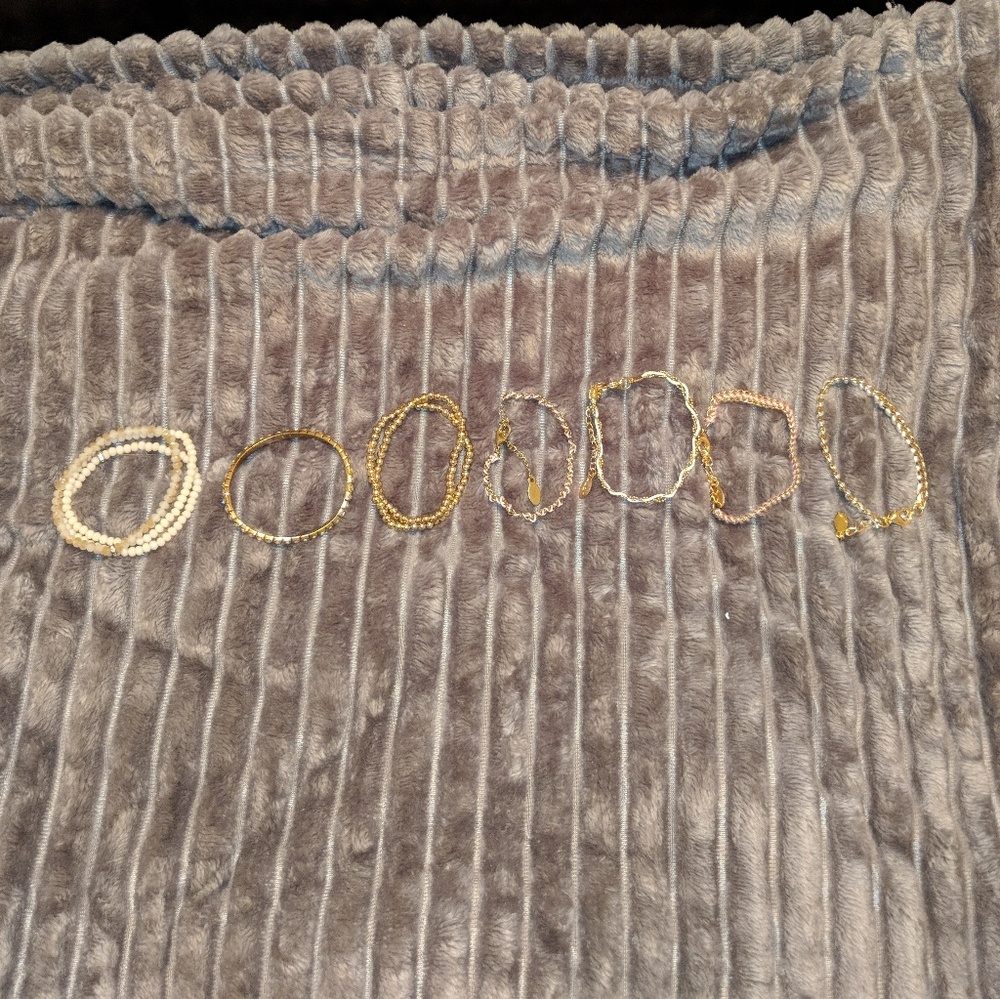 Lot of Gold, White, and Pink Aldo Bracelets